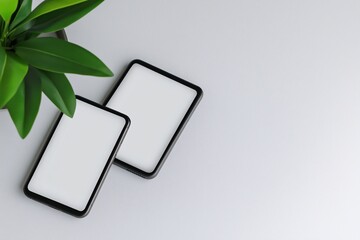 Poster - product mockup with a phone and tablet side-by-side, set on a white table for minimalistic display
