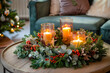 © Daria Sauer - A large Christmas wreath made of fresh pine, eucalyptus, and berries, encircling a set of three scented candles in glass jars placed at its center. Generative AI tools