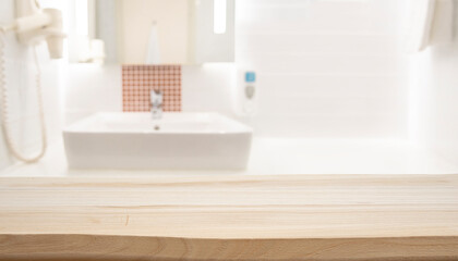 Wall Mural - empty wooden top table with blurred bathroom interior background for product display