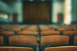 © Наталья Добровольска - Blurred auditorium with rows of seats in a conference hall, ready for seminar