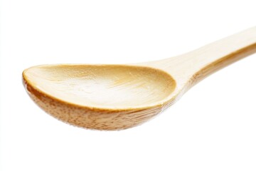 A single wooden spoon placed on a clean white surface, ready for use in cooking or baking