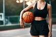 © peopleimages.com - Woman, body and basketball on court for workout, training and outdoor exercise or hobby. Confident athlete, person and fitness for goals, confidence and summer match for endurance or cardio health