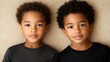 © Galib - Two young twin boys are looking at the camera.
