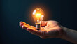 © Leah - Illuminating Idea: Hand Holding a Glowing Lightbulb