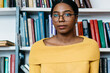 © BullRun - Black female with book near bookcase