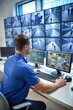 © Tekin - Security System Operator Looking At CCTV Footage