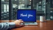 © velikiyzayats - Express Gratitude with Professionalism: Thank You Message on Laptop Screen in Modern Office Setting