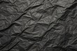 © methinee - Wrinkled black paper texture wallpaper with deep creases and folds, dark background, industrial aesthetic, faux leather look, black paper wallpaper