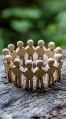 Poster - Wooden figures forming a circle on rustic wood surface