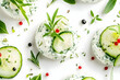 © Swaha - Appetizer of creamy cheese with cucumber slices and fresh herbs.