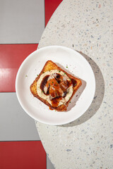 Wall Mural - Portion of brioche breakfast toast with turkey brisket and sauce