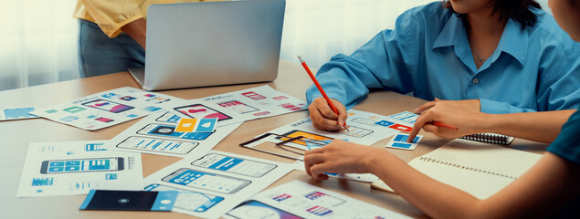Poster - panorama banner of startup company employee planning on user interface prototype for mobile applicat