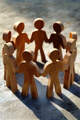 Poster - Wooden figures holding hands in a circle symbolizing teamwork and unity