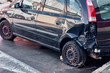 © Javier - This image shows a black car with significant damage to its rear left side. The extensive dents and scratches highlight the severity of the collision and the impact it had on the vehicle.