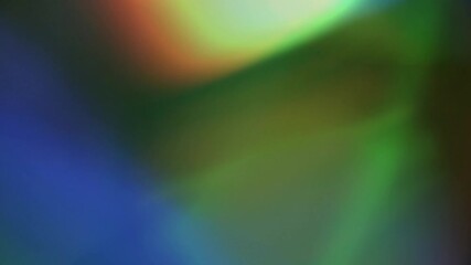 Wall Mural - rainbow light refraction show 4k loop features rainbow lens blur lights moving in different directio