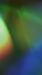 Wall Mural - vertical rainbow light refraction show 4k loop features rainbow lens blur lights moving in different