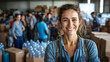 © Michael - Happy social worker standing with her team in a warehouse, arms crossed and smiling, with donations in the background
