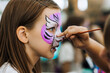 © shchus - Professional artist paints on the face, does aqua make-up, make-up for a girl at a children's party. Photography, portrait.