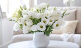 White eustoma bouquet in a white vase on a white table