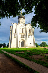 Wall Mural - Church of Intercession upon Nerl River 12th century. (Bogolyubovo, Vladimir region, Golden Ring of Russia) A warm summer evening. historical and cultural heritage of Russia.