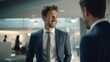 © Ivan - Smiling businessman in suit talking to colleague in office close up with space for text