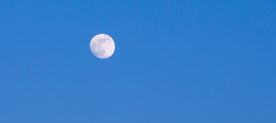 Wall Mural - moon in the blue sky background, photo as a background, digital image