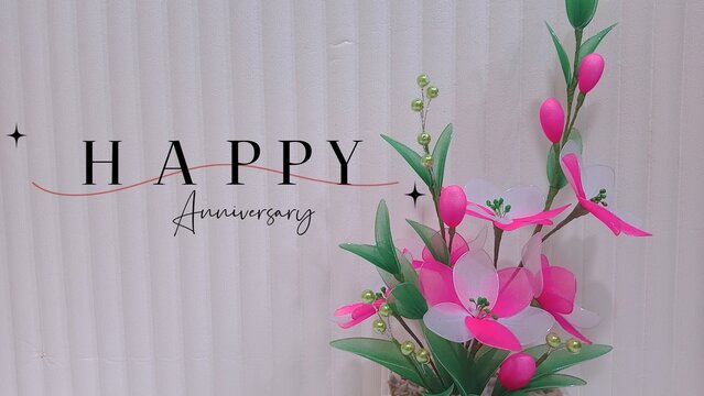 bouquet of tulips on a wooden background. Happy Birthday typography text and floral decoration on chalkboard backgroun. 