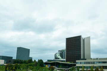 Wall Mural - View of modern skyscrapers in city on cloudy day