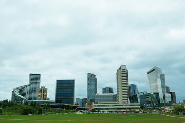 Wall Mural - View of modern skyscrapers in city on cloudy day