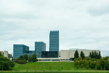Wall Mural - View of modern skyscrapers in city on cloudy day