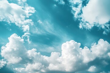 white clouds on a blue sky with a turquoise hue.