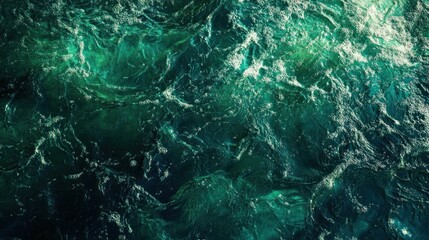 Poster - featuring a textured surface of dark green water, with soft waves and tiny splashes illuminated by s