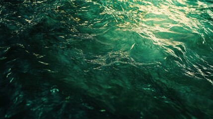 Poster - featuring a textured surface of dark green water, with soft waves and tiny splashes illuminated by s