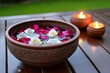 © Sanchai - Rose petals floating in a bowl of water, creating a calm and relaxing scene