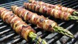 © sarun - Bacon-wrapped asparagus spears, grilled to perfection for a flavorful appetizer or side dish.