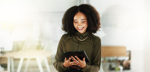 Poster - Reading, smile and tablet with business woman in glass office as artistic publication designer. Creative, editing and technology with happy Mexican illustrator in workplace for online graphic design