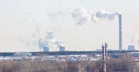 Wall Mural - A power plant is emitting smoke into the sky