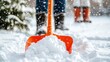 © Chanita - Shoveling snow action winter wonderland outdoor activity snowy environment close-up view winter maintenance