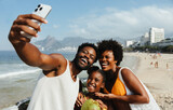 Brazilian family taking a joyful selfie in Rio de Janeiro