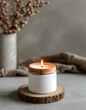 © Png - Video - Photo - A serene candle burns softly on a rustic wooden base, creating a warm and inviting atmosphere.