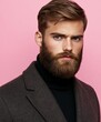 © BrandwayArt - Stylish man with a beard poses against a pink backdrop in a trendy outfit
