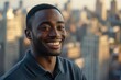 © Vii - A happy man standing in front of a city skyline, looking out at the view
