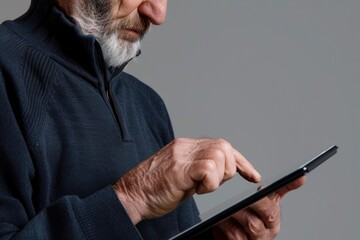 Poster - A person with a beard working on a tablet, possibly doing work or research