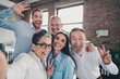 © deagreez - Photo of teamwork people working together take selfie photo comfortable modern office loft room interior indoors workspace