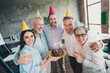 © deagreez - Portrait of group professional office workers embrace greeting birthday cake loft interior business center indoors