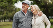 © peopleimages.com - Park, senior couple and happy with hugging on walk routine for retirement, support and bonding in Germany. People, relationship and smile outdoor for break, care and love as pensioner for date