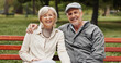 © Clement C/peopleimages.com - Senior couple, hug and portrait in park for bonding, conversation and commitment together outdoors. Retirement, marriage and mature man and women in nature on bench for love, care and connection