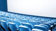 © Prompt2image - The interior of a modern cinema features rows of empty blue seats, all oriented toward a blank screen, awaiting the start of an evening showing. The ambiance suggests anticipation