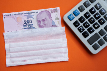 Turkish lira. Sequential in envelope. 
(On orange textured fabric background)