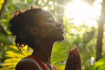 Young woman with African heritage meditating in an open forest, sunlight filtering through trees, expressing calm and inner peace, morning light, close-up of face and hands, vibrant nature around 5